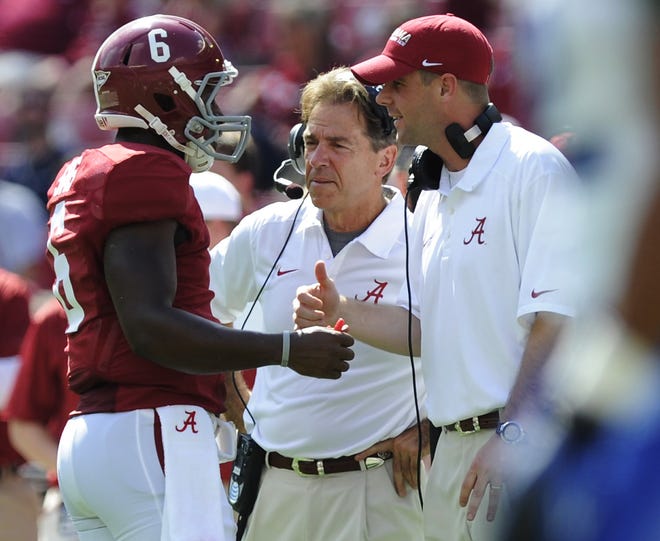 Alabama head coach Nick Saban and Alabama wide receivers coach Billy Napier talk with Alabama quarterback Blake Sims (6) in second half action at Bryant-Denny Stadium in Tuscaloosa, Ala. on Saturday October 5, 2013.(Mickey Welsh, Montgomery Advertiser)