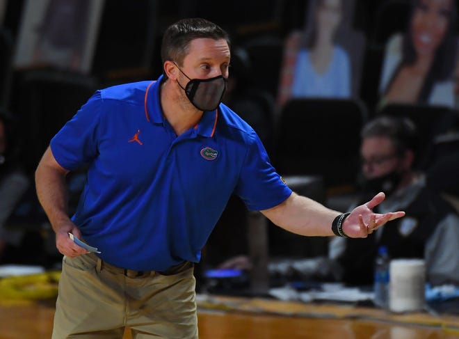 Dec 30, 2020; Nashville, Tennessee, USA; Florida Gators head coach Mike White yells back to the bench during the first half against the Vanderbilt Commodores at Memorial Gymnasium. Mandatory Credit: Christopher Hanewinckel-USA TODAY Sports