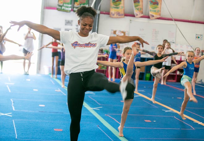 Team member Trinity Thomas leads an exercise as the University of Florida gymnastics team put on a gymnastics clinic at Balance 180 gymnastics Gainesville, FL on Saturday, March 25, 2023. More than 100 young gymnasts learned gymnastics training and routines. They also  met the gymnasts to get autographs and pictures at the NIL Gatorverse event. [Alan Youngblood/Gainesville Sun]