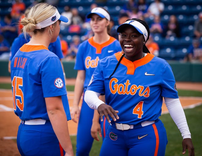 Florida third baseman Charla Echols (4) was all smiles after being introduced at the beginning of the game. The Florida women’s softball team hosted Stetson at Katie Seashole Pressly Stadium in Gainesville, FL on Wednesday, March 29, 2023. Florida won 8-0 in six. [Doug Engle/Gainesville Sun]