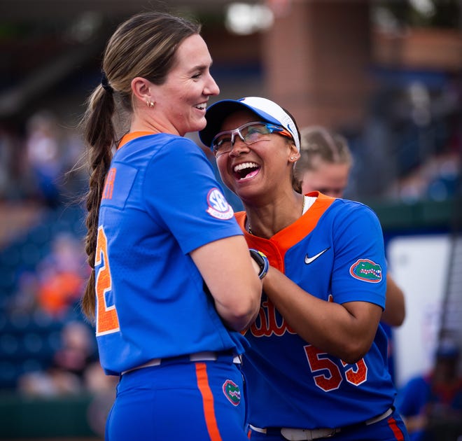 Florida starting pitcher/relief pitcher Elizabeth Hightower (22) and Florida utility Pal Egan (55) joke around before the game. The Florida women’s softball team hosted Stetson at Katie Seashole Pressly Stadium in Gainesville, FL on Wednesday, March 29, 2023. Florida won 8-0 in six. [Doug Engle/Gainesville Sun]