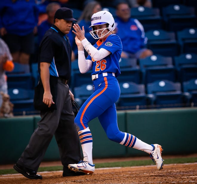 Florida outfielder Christina Wellen (26) claps as she scores in the bottom of the 6th to make it 7-0. The Florida women’s softball team hosted Stetson at Katie Seashole Pressly Stadium in Gainesville, FL on Wednesday, March 29, 2023. Florida won 8-0 in six. [Doug Engle/Gainesville Sun]