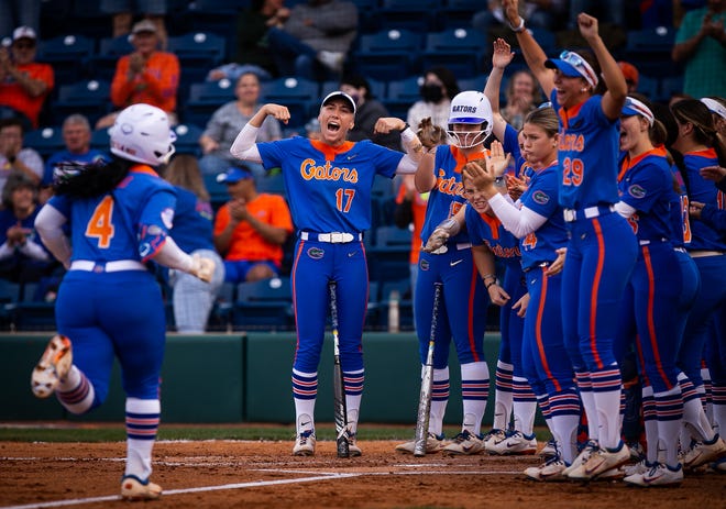 Florida third baseman Charla Echols (4) is greeted at home plate after hitting a solo home run in the bottom of the first. The Florida women’s softball team hosted Stetson at Katie Seashole Pressly Stadium in Gainesville, FL on Wednesday, March 29, 2023. Florida won 8-0 in six. [Doug Engle/Gainesville Sun]