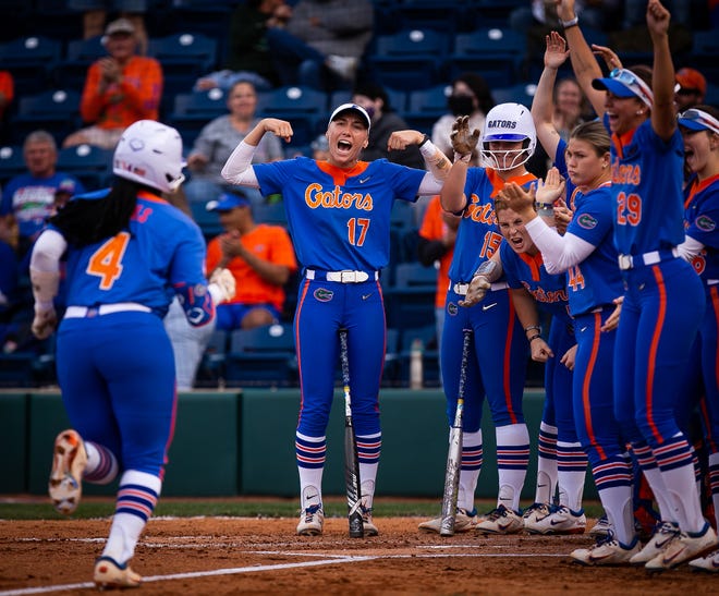Florida third baseman Charla Echols (4) is greeted at home plate after hitting a solo home run in the bottom of the first. The Florida women’s softball team hosted Stetson at Katie Seashole Pressly Stadium in Gainesville, FL on Wednesday, March 29, 2023. Florida won 8-0 in six. [Doug Engle/Gainesville Sun]