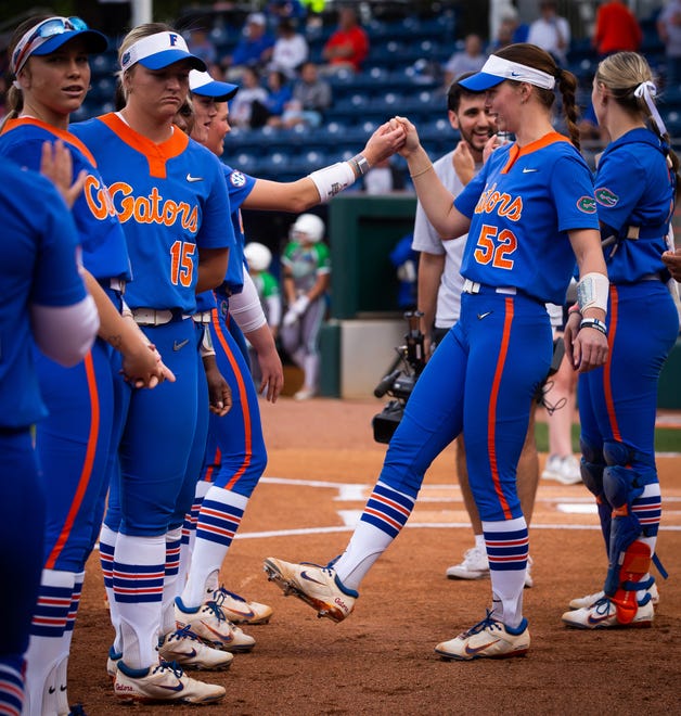 Florida utility Sarah Longley (52) gets her team up before the start of the game. The Florida women’s softball team hosted Stetson at Katie Seashole Pressly Stadium in Gainesville, FL on Wednesday, March 29, 2023. Florida won 8-0 in six. [Doug Engle/Gainesville Sun]