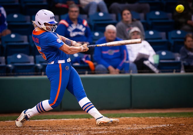 Florida infielder Reagan Walsh (15) drives in a run in the bottom of the 6th ending the game 8-0. The Florida women’s softball team hosted Stetson at Katie Seashole Pressly Stadium in Gainesville, FL on Wednesday, March 29, 2023. Florida won 8-0 in six. [Doug Engle/Gainesville Sun]