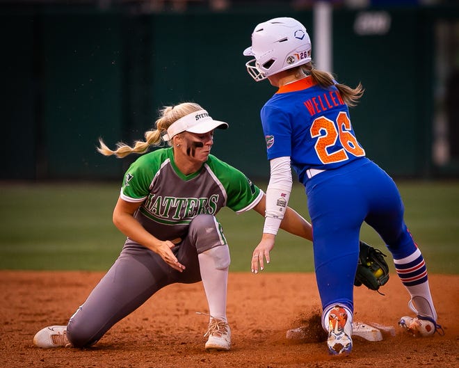 Florida outfielder Christina Wellen (26) steals second in the bottom of the 6th as Stetson Kami Eppley (4) gets the ball late. The Florida women’s softball team hosted Stetson at Katie Seashole Pressly Stadium in Gainesville, FL on Wednesday, March 29, 2023. Florida won 8-0 in six. [Doug Engle/Gainesville Sun]