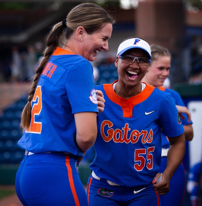 Florida starting pitcher/relief pitcher Elizabeth Hightower (22) and Florida utility Pal Egan (55) joke around before the game. The Florida women’s softball team hosted Stetson at Katie Seashole Pressly Stadium in Gainesville, FL on Wednesday, March 29, 2023. Florida won 8-0 in six. [Doug Engle/Gainesville Sun]