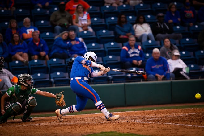 Florida third baseman Charla Echols (4) hits a double in the bottom of the 6th. The Florida women’s softball team hosted Stetson at Katie Seashole Pressly Stadium in Gainesville, FL on Wednesday, March 29, 2023. Florida won 8-0 in six. [Doug Engle/Gainesville Sun]