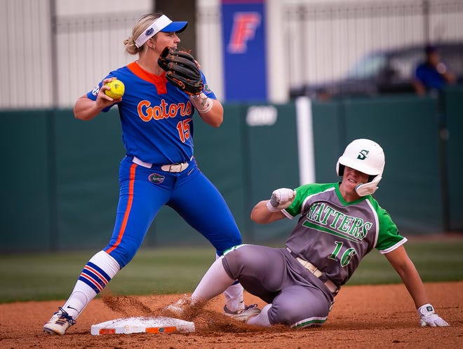 Florida infielder Reagan Walsh (15) forces out Stetson infielder Evette Morgan (16) in the top of the first. The Florida women’s softball team hosted Stetson at Katie Seashole Pressly Stadium in Gainesville, FL on Wednesday, March 29, 2023. Florida won 8-0 in six. [Doug Engle/Gainesville Sun]