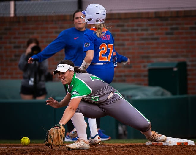 Florida outfielder Kendra Falby (27) safe at first in the bottom of the third as Stetson infielder Evette Morgan (16) gets the ball late. The Florida women’s softball team hosted Stetson at Katie Seashole Pressly Stadium in Gainesville, FL on Wednesday, March 29, 2023. Florida won 8-0 in six. [Doug Engle/Gainesville Sun]