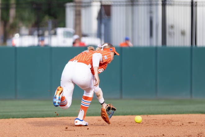 Florida Gators infielder Skylar Wallace (17) scoops the ball during the game against the Auburn Tigers at Katie Seashole Pressly Stadium at the University of Florida in Gainesville, FL on Thursday, April 6, 2023. [Matt Pendleton/Gainesville Sun]