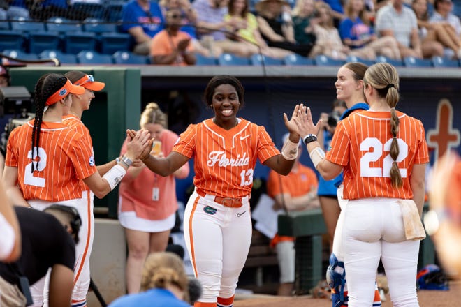 Florida Gators catcher Sam Roe (13) smiles as she is introduced before the game against the Auburn Tigers at Katie Seashole Pressly Stadium at the University of Florida in Gainesville, FL on Thursday, April 6, 2023. [Matt Pendleton/Gainesville Sun]