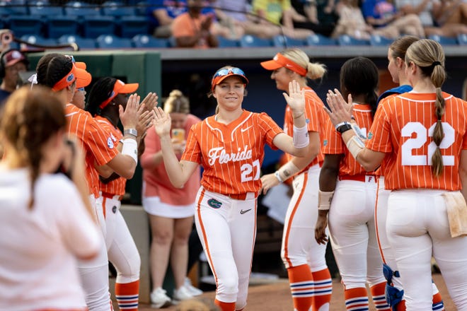 Florida Gators outfielder Kendra Falby (27) high fives as she is introduced before the game against the Auburn Tigers at Katie Seashole Pressly Stadium at the University of Florida in Gainesville, FL on Thursday, April 6, 2023. [Matt Pendleton/Gainesville Sun]