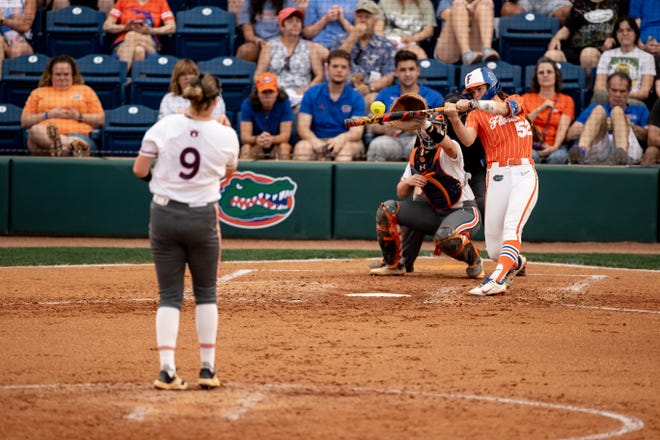 Florida Gators utility Sarah Longley (52) hits the ball during the game against the Auburn Tigers at Katie Seashole Pressly Stadium at the University of Florida in Gainesville, FL on Thursday, April 6, 2023. [Matt Pendleton/Gainesville Sun]