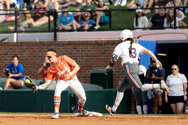 Florida Gators first baseman Avery Goelz (2) makes a catch at first for the out on Auburn Tigers infielder Nelia Peralta (13) during the game at Katie Seashole Pressly Stadium at the University of Florida in Gainesville, FL on Thursday, April 6, 2023. [Matt Pendleton/Gainesville Sun]