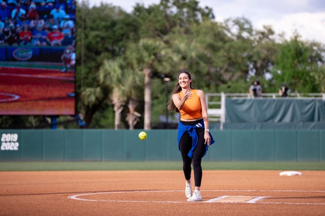 Florida Gators softball alum Francesca Enea throws out the first pitch before the game against the Auburn Tigers at Katie Seashole Pressly Stadium at the University of Florida in Gainesville, FL on Thursday, April 6, 2023. [Matt Pendleton/Gainesville Sun]