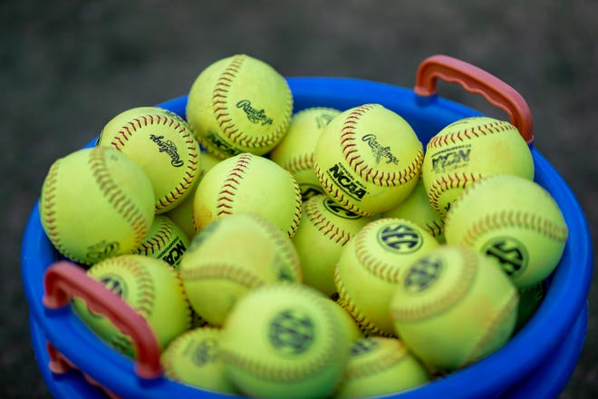 Softballs in a bucket before the game between the Florida Gators and Auburn Tigers during the softball game at Katie Seashole Pressly Stadium at the University of Florida in Gainesville, FL on Thursday, April 6, 2023. [Matt Pendleton/Gainesville Sun]