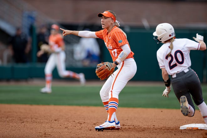 Florida Gators infielder Skylar Wallace (17) gestures while Auburn Tigers outfielder Abbey Smith (20) rounds second base during the game at Katie Seashole Pressly Stadium at the University of Florida in Gainesville, FL on Thursday, April 6, 2023. [Matt Pendleton/Gainesville Sun]