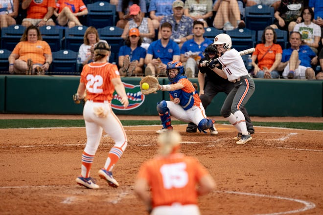Florida Gators utility Sarah Longley (52) catches the ball from Florida Gators pitcher Elizabeth Hightower (22) during the game against the Auburn Tigers at Katie Seashole Pressly Stadium at the University of Florida in Gainesville, FL on Thursday, April 6, 2023. [Matt Pendleton/Gainesville Sun]