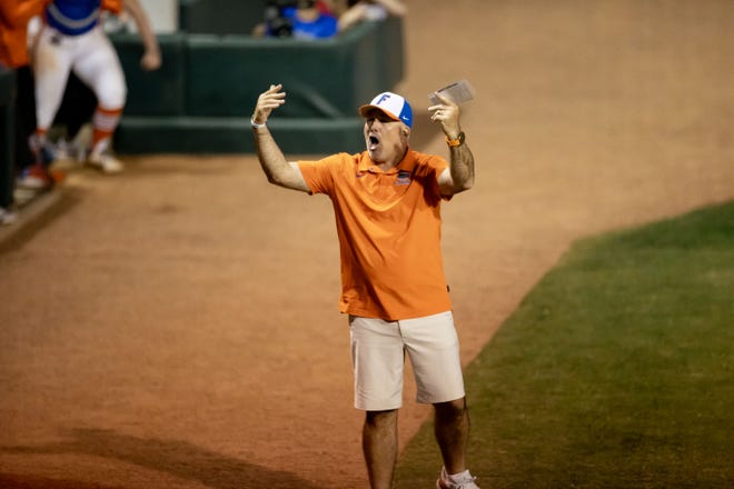 Florida Gators head coach Tim Walton hypes the crowd during the last at-bat during the game against the Auburn Tigers at Katie Seashole Pressly Stadium at the University of Florida in Gainesville, FL on Thursday, April 6, 2023. [Matt Pendleton/Gainesville Sun]