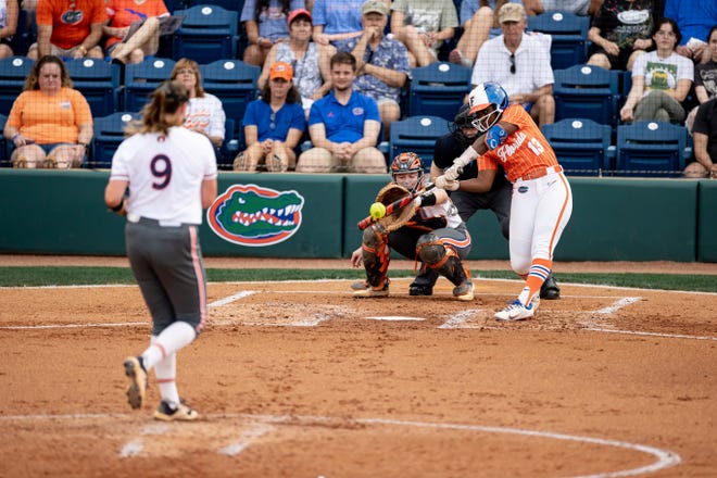 Florida Gators catcher Sam Roe (13) hits the ball during the game against the Auburn Tigers at Katie Seashole Pressly Stadium at the University of Florida in Gainesville, FL on Thursday, April 6, 2023. [Matt Pendleton/Gainesville Sun]