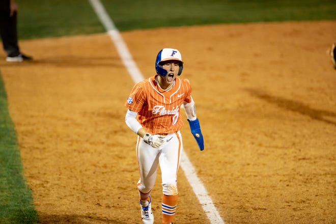 Florida Gators infielder Skylar Wallace (17) screams as she scores the winning run during the game against the Auburn Tigers at Katie Seashole Pressly Stadium at the University of Florida in Gainesville, FL on Thursday, April 6, 2023. [Matt Pendleton/Gainesville Sun]