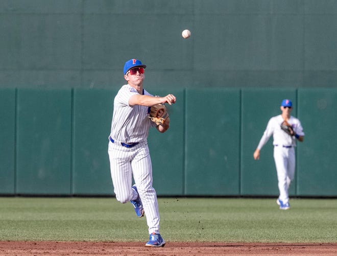 Florida's infielder Cade Kurland (4) with the throw to first for the out against Florida State University in the top of the seconding, Tuesday, April 11, 2023, at Condron Family Baseball Park in Gainesville, Florida. The Gators beat the Seminoles 5-3. [Cyndi Chambers/ Gainesville Sun] 2023