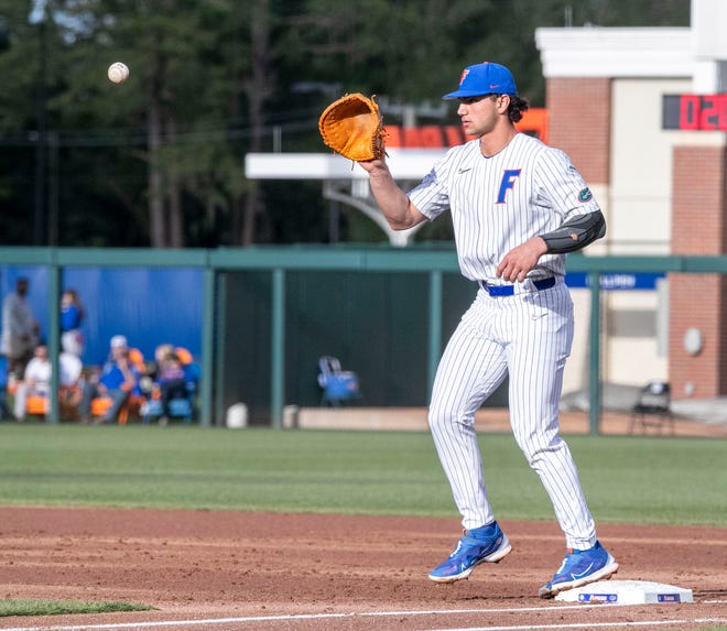 Florida's utility Jac Caglianone (14) with the out at first against Florida State University, Tuesday, April 11, 2023, at Condron Family Baseball Park in Gainesville, Florida. The Gators beat the Seminoles 5-3. [Cyndi Chambers/ Gainesville Sun] 2023