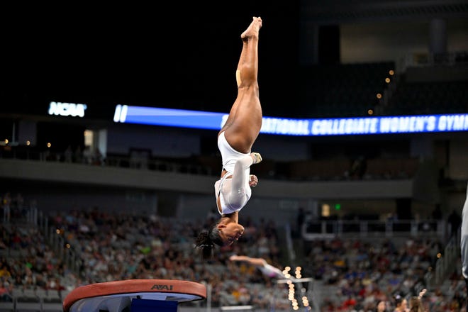 Apr 15, 2023; Fort Worth, TX, USA; University of Florida Gators gymnast Trinity Thomas earns a perfect score on vault during the NCAA Women's National Gymnastics Tournament Championship at Dickies Arena. Mandatory Credit: Jerome Miron-USA TODAY Sports