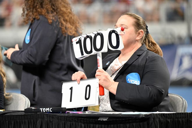 Apr 15, 2023; Fort Worth, TX, USA; A view of the judges holding a ten score up for University of Florida Gators gymnast Trinity Thomas on vault during the NCAA Women's National Gymnastics Tournament Championship at Dickies Arena. Mandatory Credit: Jerome Miron-USA TODAY Sports