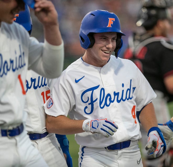 Florida's infielder Cade Kurland (4) with a grand slam in the bottom of the third inning against against Georgia, Friday, April 14, 2023, at Condron Family Baseball Park in Gainesville, Florida. The Gators lost Game 1 of the weekend series to the Bulldogs 13-11. [Cyndi Chambers/ Gainesville Sun] 2023