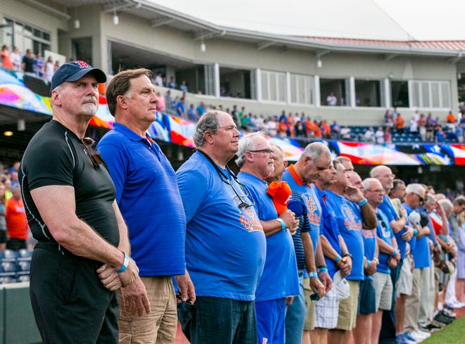 Former Gator baseball players from the 1970's teams gathered for a reunion during the Florida vs Georgia series, Saturday, April 15, 2023, at Condron Family Baseball Park in Gainesville, Florida.  The former players are seen here before the start of Game 2 of the weekend series against Georgia. [Cyndi Chambers/ Gainesville Sun] 2023
