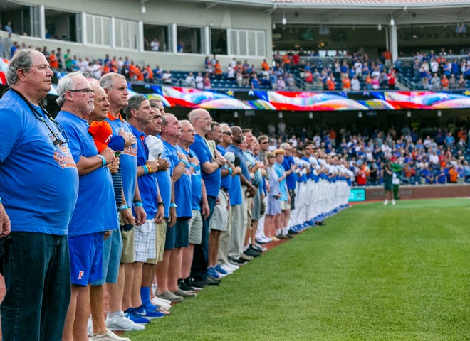 Former Gator baseball players from the 1970's teams gathered for a reunion during the Florida vs Georgia series, Saturday, April 15, 2023, at Condron Family Baseball Park in Gainesville, Florida.  The former players are seen here before the start of Game 2 of the weekend series against Georgia. [Cyndi Chambers/ Gainesville Sun] 2023