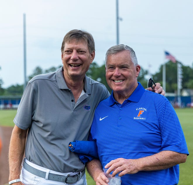 Former Gator baseball players Nick Belmont (left) and Terry Fitzgerald (right) joined other former players from the 1970's teams for a reunion during the Florida vs Georgia series, Saturday, April 15, 2023, at Condron Family Baseball Park in Gainesville, Florida.  Some of the former players are seen here before the start of Game 2 of the weekend series against Georgia. [Cyndi Chambers/ Gainesville Sun] 2023