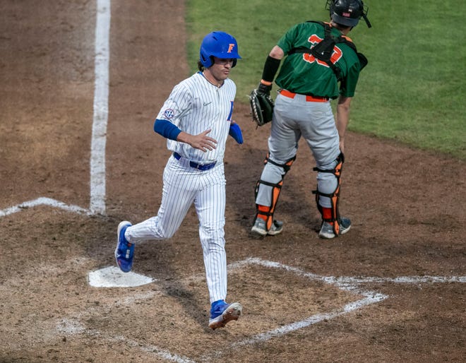 Florida's outfielder Tucker Talbott (32) scores a run against Florida A&M. Florida beat FAMU17-7 in 7 innings of play, Tuesday, April 18, 2023, at Condron Family Baseball Park in Gainesville, Florida.[Cyndi Chambers/ Gainesville Sun] 2023