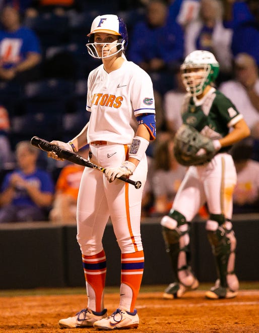 Florida utility Emily Wilkie (18) gets some instructions from the coach in the bottom of the seventh. The Florida women’s softball team hosted USF at Katie Seashole Pressly Stadium in Gainesville, FL on Wednesday, April 19, 2023. Florida won 7-3 by hitting a grand slam in the bottom of the seventh inning. [Doug Engle/Gainesville Sun]