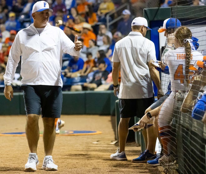 Florida Head Coach Tim Walton gives a thumbs up to his dugout in the seventh inning. The Florida women’s softball team hosted USF at Katie Seashole Pressly Stadium in Gainesville, FL on Wednesday, April 19, 2023. Florida won 7-3 by hitting a grand slam in the bottom of the seventh inning. [Doug Engle/Gainesville Sun]