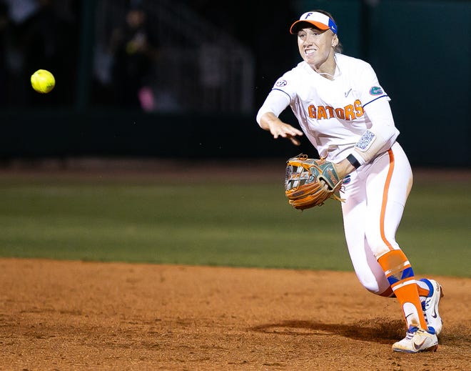 Florida infielder Skylar Wallace (17) throws an out at first in the top of the fifth. The Florida women’s softball team hosted USF at Katie Seashole Pressly Stadium in Gainesville, FL on Wednesday, April 19, 2023. Florida won 7-3 by hitting a grand slam in the bottom of the seventh inning. [Doug Engle/Gainesville Sun]