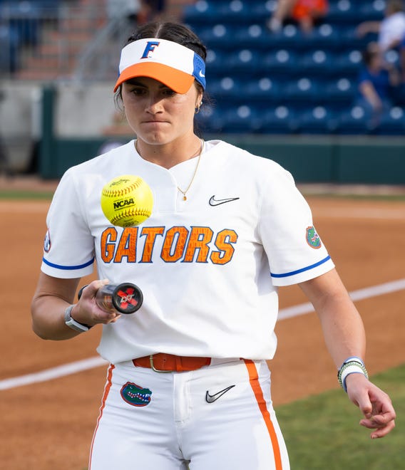 Florida first baseman Avery Goelz (2) warms up before the start of the game. The Florida women’s softball team hosted USF at Katie Seashole Pressly Stadium in Gainesville, FL on Wednesday, April 19, 2023. Florida won 7-3 by hitting a grand slam in the bottom of the seventh inning. [Doug Engle/Gainesville Sun]