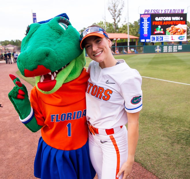 Florida outfielder Christina Wellen (26) poses with Alberta on her birthday. The Florida women’s softball team hosted USF at Katie Seashole Pressly Stadium in Gainesville, FL on Wednesday, April 19, 2023. Florida won 7-3 by hitting a grand slam in the bottom of the seventh inning. [Doug Engle/Gainesville Sun]