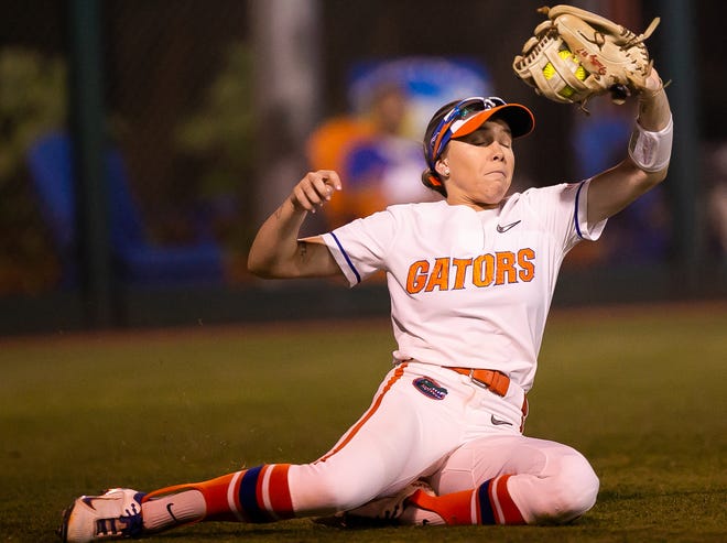 Florida outfielder Kendra Falby (27) catches a fly ball for an out in the top of the seventh. The Florida women’s softball team hosted USF at Katie Seashole Pressly Stadium in Gainesville, FL on Wednesday, April 19, 2023. Florida won 7-3 by hitting a grand slam in the bottom of the seventh inning. [Doug Engle/Gainesville Sun]