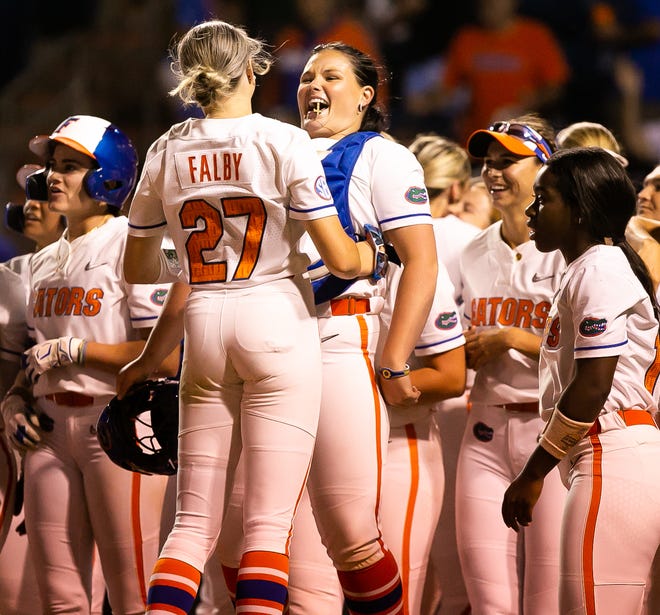 Florida outfielder Kendra Falby (27) and Florida relief pitcher Lexie Delbrey (16) celebrate after Florida utility Emily Wilkie (18) hit a grand slam in the bottom of the seventh to win the game 7-3. The Florida women’s softball team hosted USF at Katie Seashole Pressly Stadium in Gainesville, FL on Wednesday, April 19, 2023. Florida won 7-3 by hitting a grand slam in the bottom of the seventh inning. [Doug Engle/Gainesville Sun]The Florida women’s softball team hosted USF at Katie Seashole Pressly Stadium in Gainesville, FL on Wednesday, April 19, 2023. Florida won 7-3 by hitting a grand slam in the bottom of the seventh inning. [Doug Engle/Gainesville Sun]