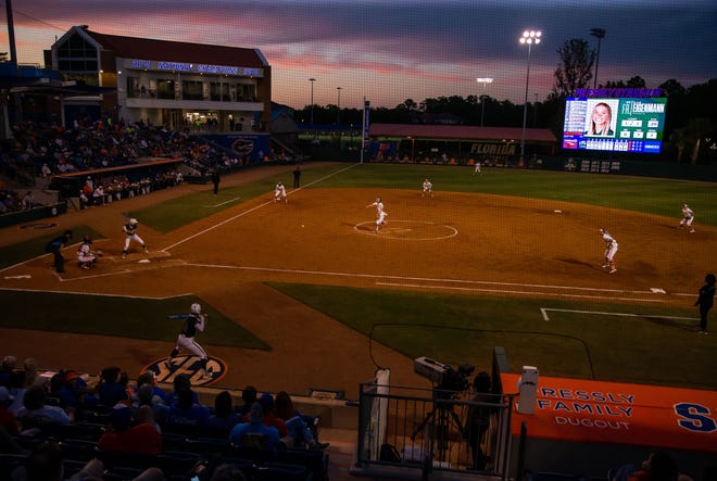 The sun sets as the Florida women’s softball team hosted USF at Katie Seashole Pressly Stadium in Gainesville, FL on Wednesday, April 19, 2023. Florida won 7-3 by hitting a grand slam in the bottom of the seventh inning. [Doug Engle/Gainesville Sun]