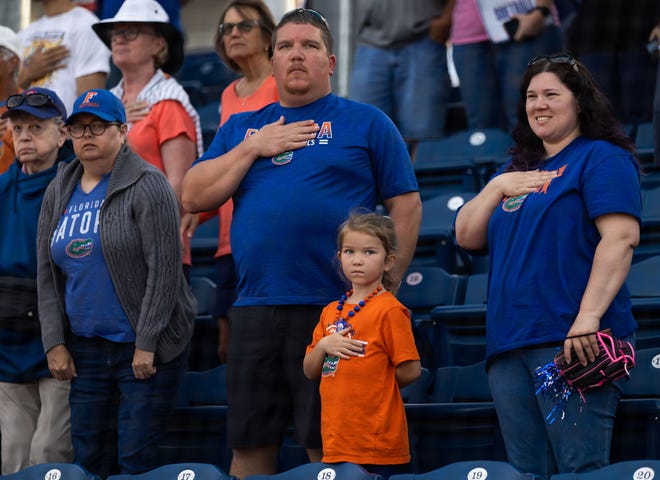 Florida fans during the playing of the National Anthem. The Florida women’s softball team hosted USF at Katie Seashole Pressly Stadium in Gainesville, FL on Wednesday, April 19, 2023. Florida won 7-3 by hitting a grand slam in the bottom of the seventh inning. [Doug Engle/Gainesville Sun]
