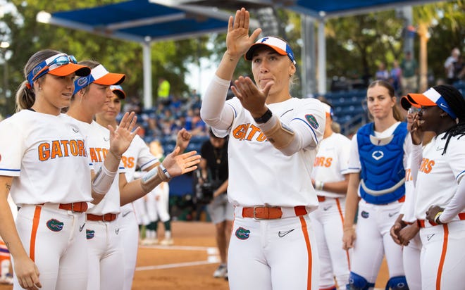 Florida infielder Skylar Wallace (17) gives her Gator Chomp while being introduced to fans. The Florida women’s softball team hosted USF at Katie Seashole Pressly Stadium in Gainesville, FL on Wednesday, April 19, 2023. Florida won 7-3 by hitting a grand slam in the bottom of the seventh inning. [Doug Engle/Gainesville Sun]