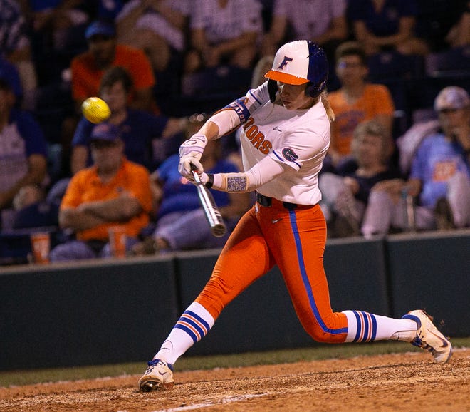Florida Gators infielder Skylar Wallace (17) hits her second home run of the night. The Florida women’s softball team hosted FSU at Katie Seashole Pressly Stadium in Gainesville, FL on Wednesday, May 3, 2023. The Seminoles defeated the Gators 8-7.  [Doug Engle/Gainesville Sun]