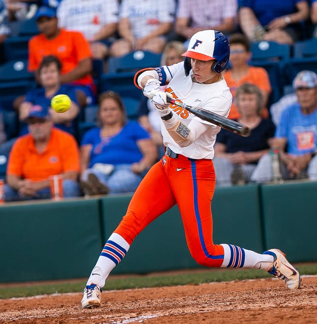 Florida Gators infielder Skylar Wallace (17) hits a home run in the bottom of the fourth to go ahead of the Seminoles 4-3. The Florida women’s softball team hosted FSU at Katie Seashole Pressly Stadium in Gainesville, FL on Wednesday, May 3, 2023. The Seminoles defeated the Gators 8-7.  [Doug Engle/Gainesville Sun]