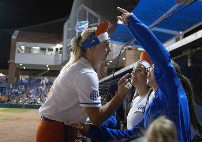 Florida Gators infielder Reagan Walsh (15) gets her teammates excited while wearing her rally cap in the seventh inning. The Florida women’s softball team hosted FSU at Katie Seashole Pressly Stadium in Gainesville, FL on Wednesday, May 3, 2023. The Seminoles defeated the Gators 8-7.  [Doug Engle/Gainesville Sun]