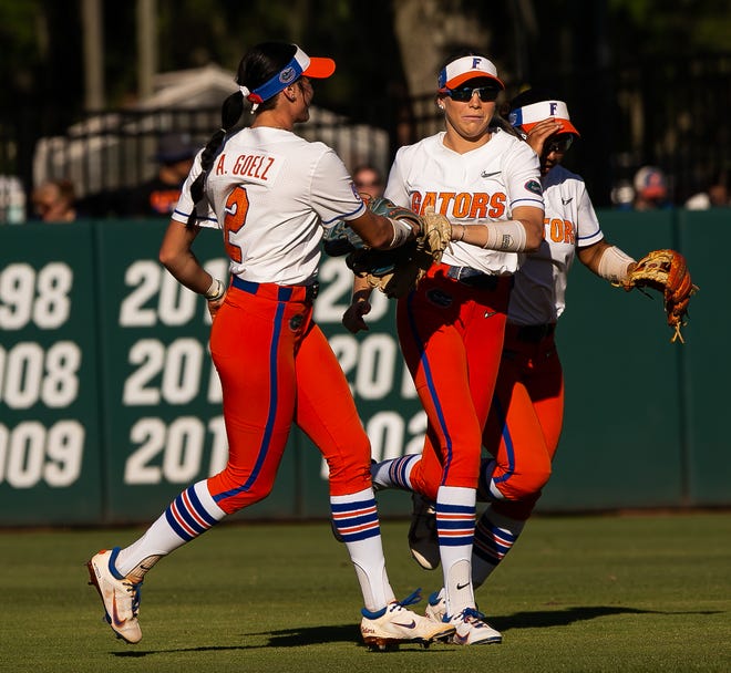 Florida Gators outfielder Kendra Falby (27) is congratulated by teammate after catching an out in the top of the first. The Florida women’s softball team hosted FSU at Katie Seashole Pressly Stadium in Gainesville, FL on Wednesday, May 3, 2023. The Seminoles defeated the Gators 8-7.  [Doug Engle/Gainesville Sun]